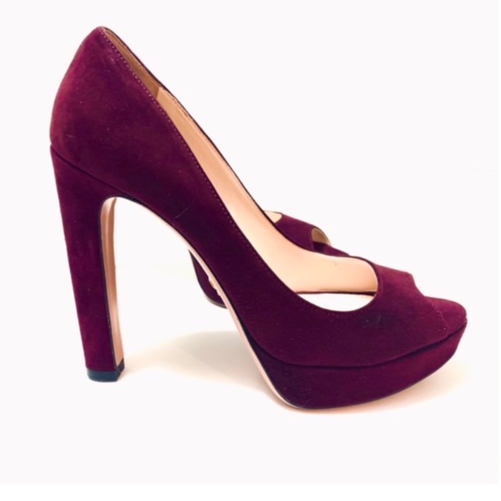 Prada mint condition dark purple,maroon suede, peep toe 5” pumps.